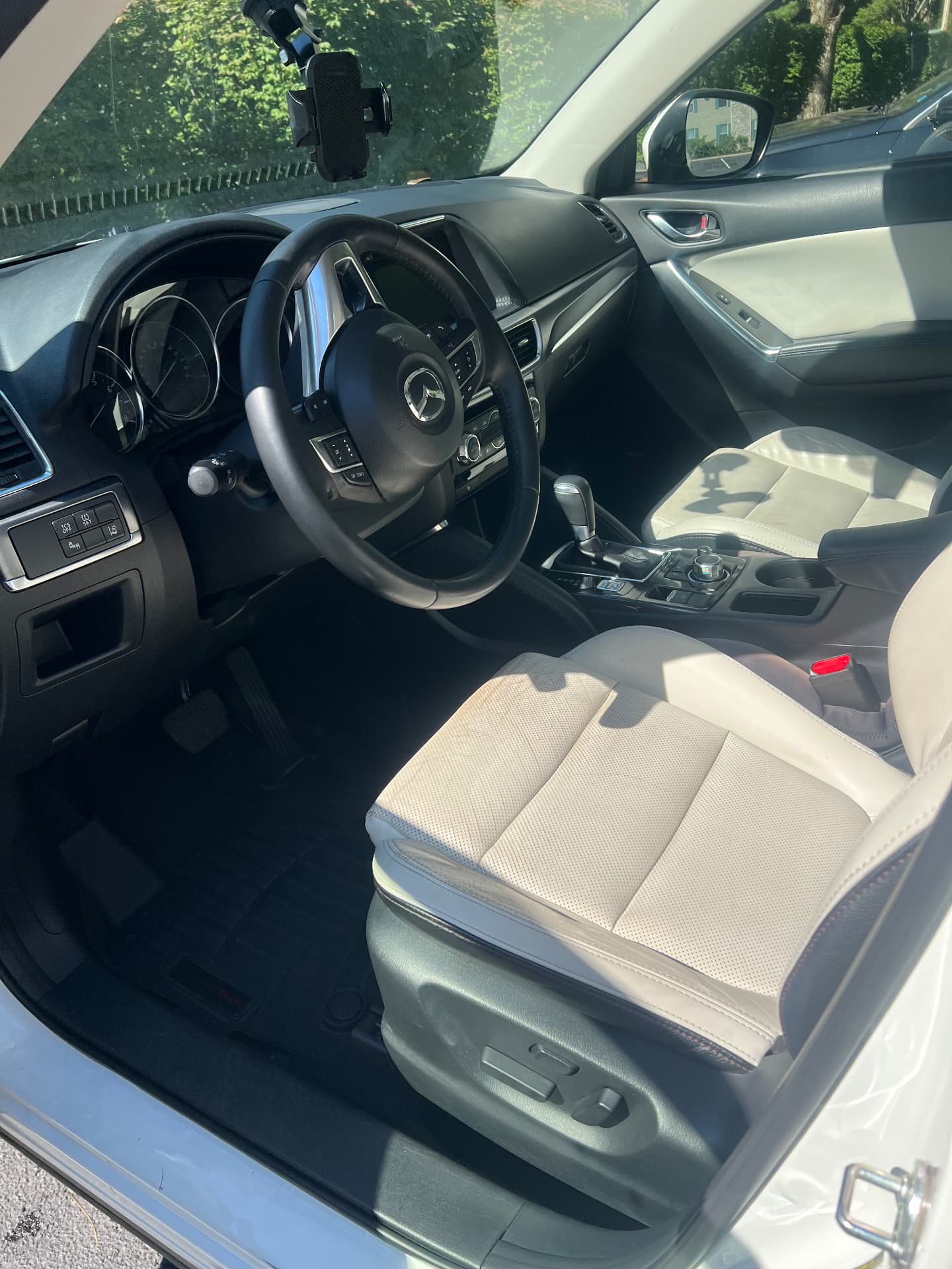 Mazda cabin with spotless cream leather seats after an interior reset