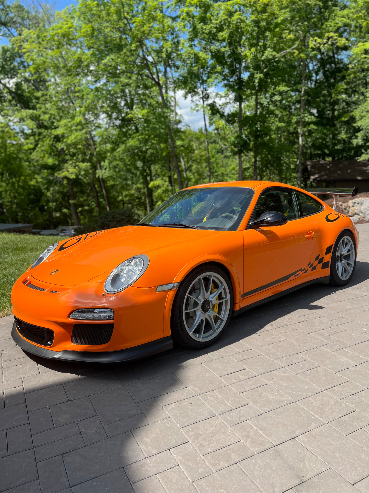 Orange Porsche 911 with a deep, glossy polished finish