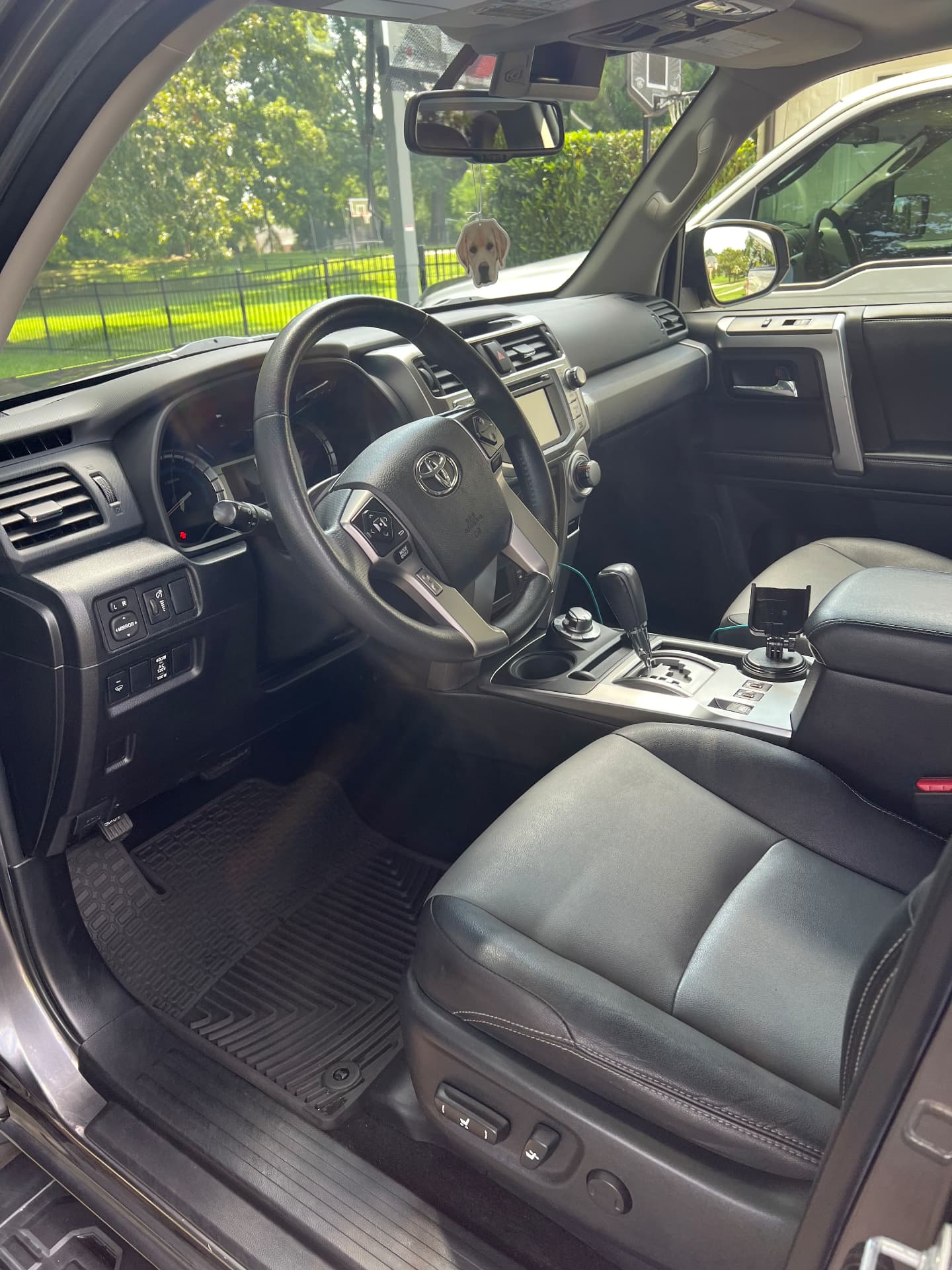 Toyota 4Runner interior with cleaned black leather seats and floor liners